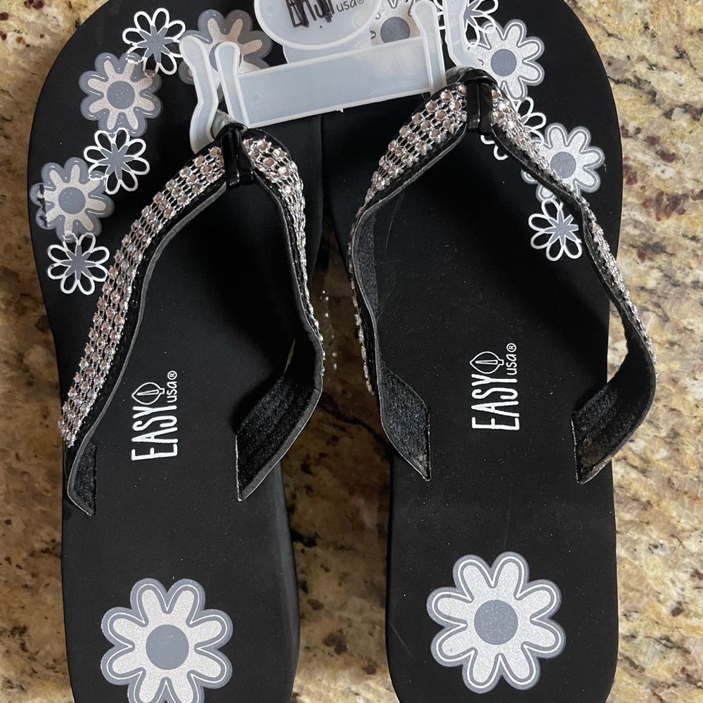 Flip flops with flowers on them. 2” heel.  Never worn.  New without tag